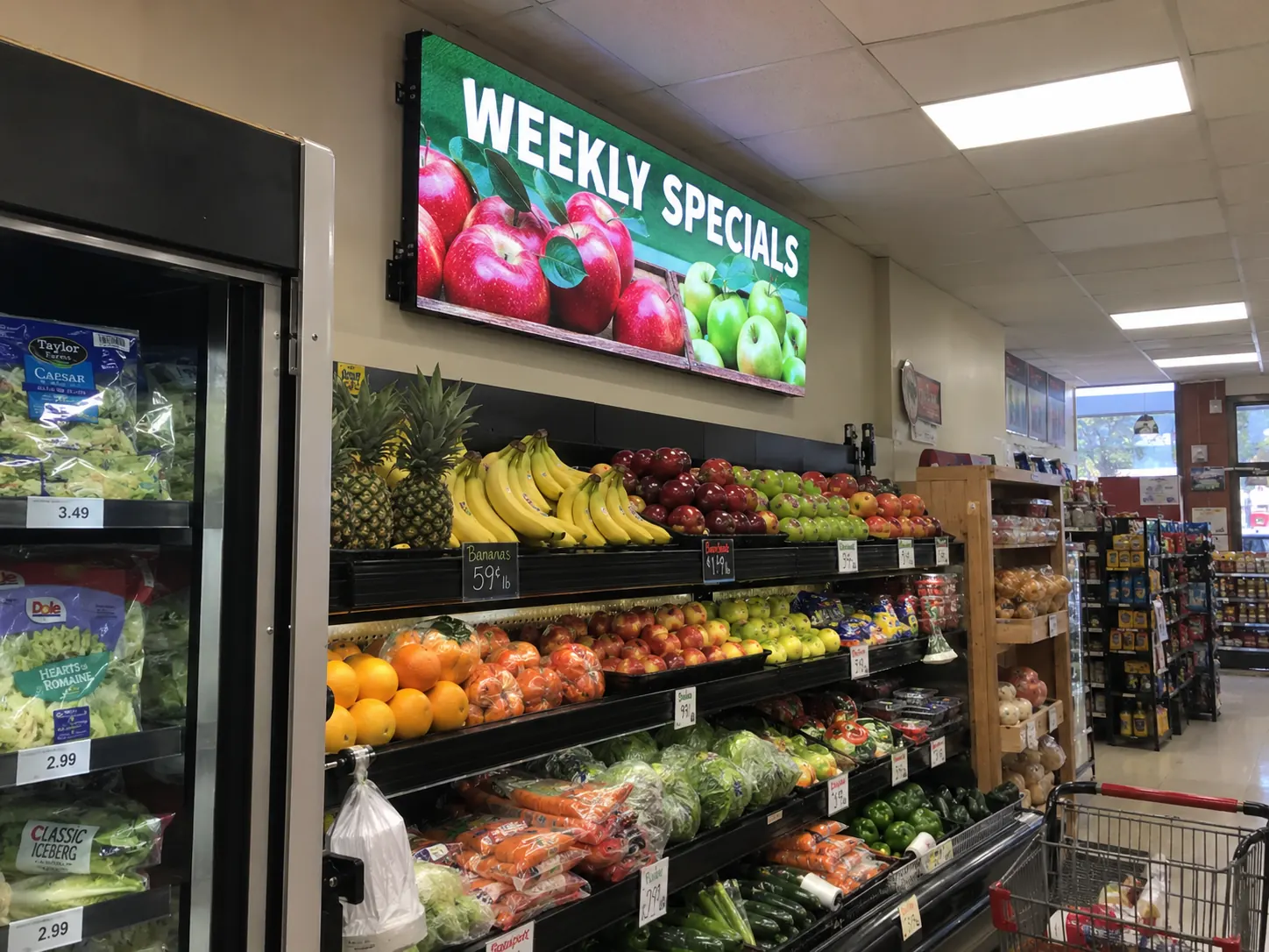 Grocery store promotional LED display Indoor LED promotional display above produce in a grocery store